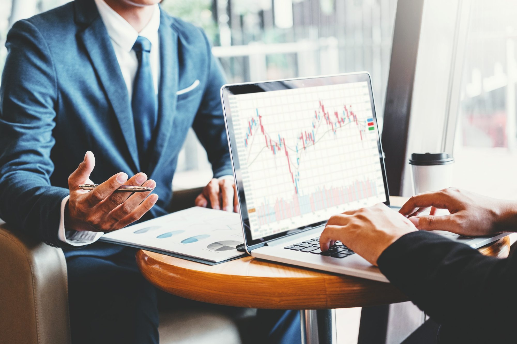 Two business people reviewing report